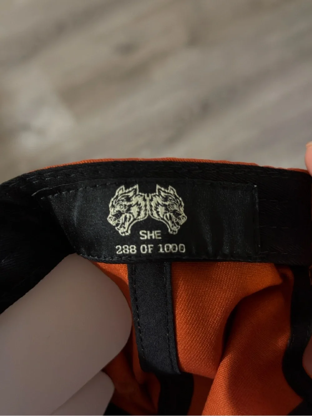 She Darc Sport Orange Cap with White Wolf Emblem